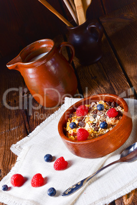 rustic muesli breakfast with forest fruits