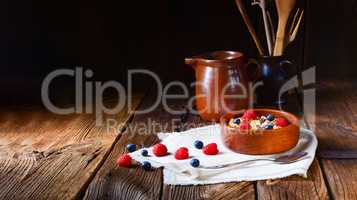 rustic muesli breakfast with forest fruits