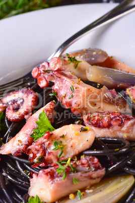 octopus with black spaghetti and garlic sauce