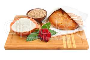 Bread, grain and flour isolated on white background.