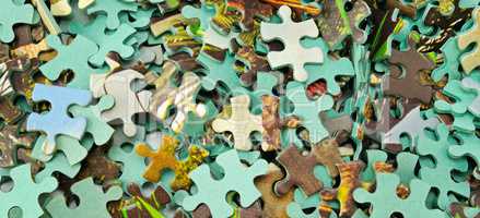 Jigsaw puzzle color background. Wide photo.