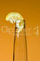 Bottle with chunk of lemon