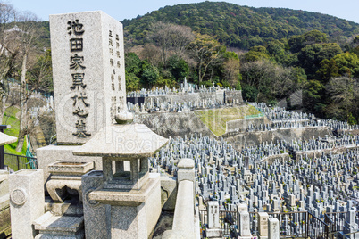 Old stone graves and headstones at a Buddhist cemetery in Japan