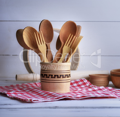 wooden spoons and forks in a wooden container
