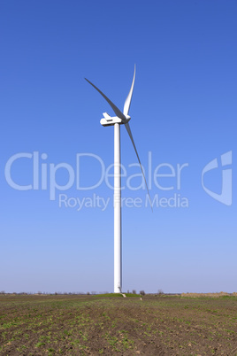 big windmill in the middle of the field