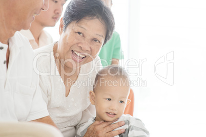 Happy family sitting at home