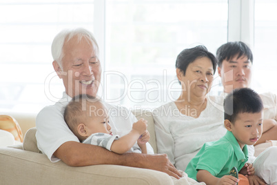 Asian family relaxed at home