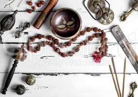 Copper singing bowl, prayer beads, prayer drum, stone balls and