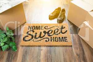 Home Sweet Home Welcome Mat, Moving Boxes, Shoes and Plant on Ha