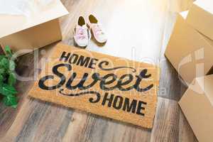 Home Sweet Home Welcome Mat, Moving Boxes, Pink Shoes and Plant
