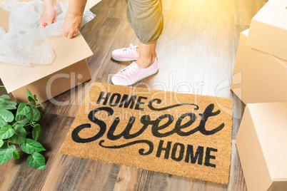 Woman in Pink Shoes and Sweats Unpacking Near Home Sweet Home We