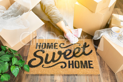 Woman Wearing Sweats Relaxing Near Home Sweet Home Welcome Mat,