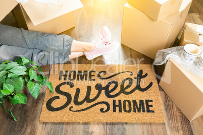 Woman Wearing Sweats Relaxing Near Home Sweet Home Welcome Mat,