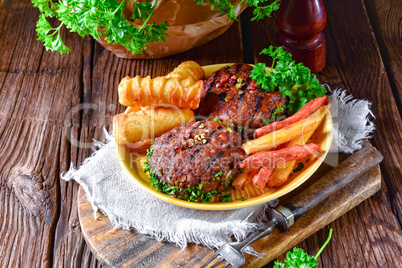 grilled bullets with croquettes and vegetables