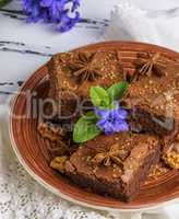 chocolate brownie pieces lie on a round plate