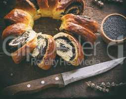 baked round pie with poppy seeds
