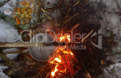 picnic in winter on nature of a bonfire