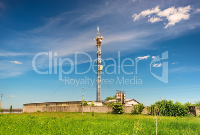 TV tower on green field
