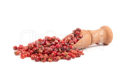 Pink pepper, Red peppercorns in a wooden spoon