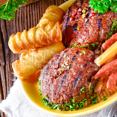 grilled bullets with croquettes and vegetables