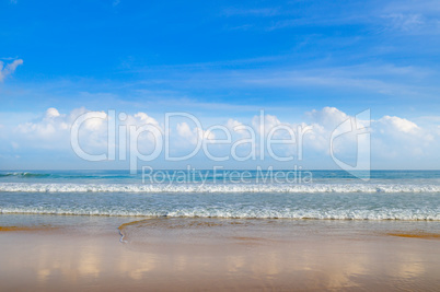 Deserted sandy beach of the Indian Ocean and blue sky,