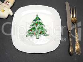 white square plate and a vintage knife with a fork