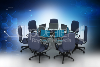 Conference table with laptops in color background
