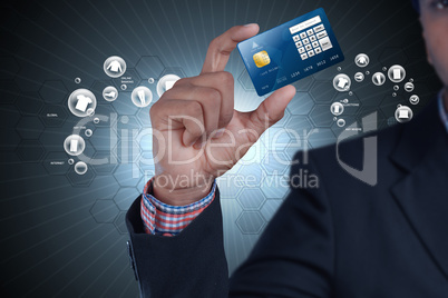 Business man showing credit card in color background