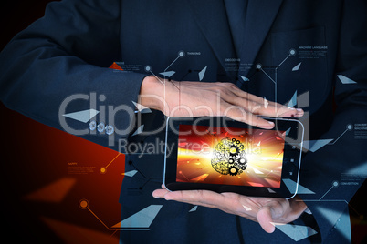Man showing brain and gear wheels on smart phone in color back ground