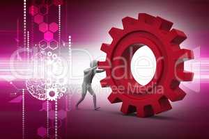 Man pushing gear wheel in color background