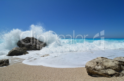 White wave splash over dark stone, famous Kathisma beach
