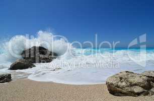 White wave splash over dark stone, famous Kathisma beach