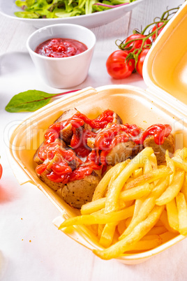 grilled bratwurst with French fries  and ketchup