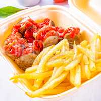 grilled bratwurst with French fries  and ketchup