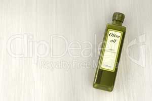 Olive oil bottle on wood background