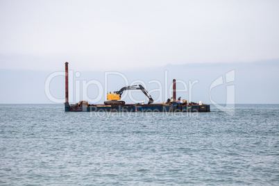 Excavator and dredging equipment at Wiggins Pass