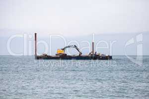 Excavator and dredging equipment at Wiggins Pass