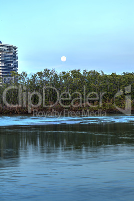 Moonrise over River leading to the ocean at Clam Pass