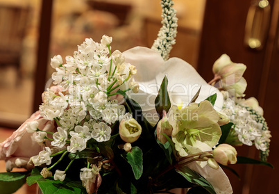 Bouquet of white flowers including roses