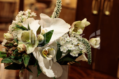 Bouquet of white flowers including roses