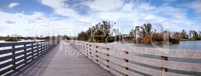 Boardwalk goes through the swamp at Lakes Park and shows Hurrica