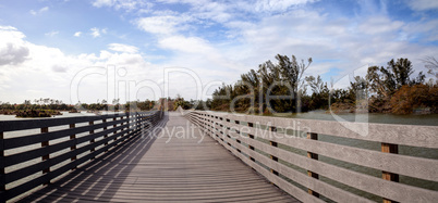Boardwalk goes through the swamp at Lakes Park and shows Hurrica