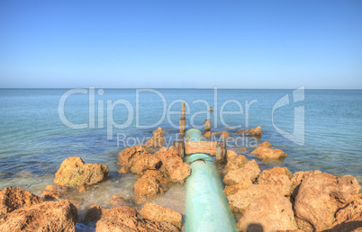 Drainage pipe leads into the ocean at Lowdermilk Beach