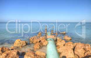 Drainage pipe leads into the ocean at Lowdermilk Beach