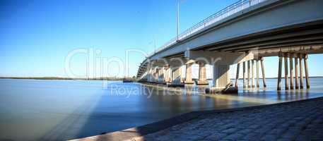 Blue sky over the bridge roadway that journeys onto Marco Island