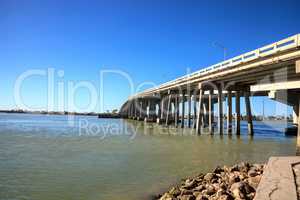 Blue sky over the bridge roadway that journeys onto Marco Island