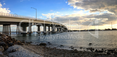 Blue sky over the bridge roadway that journeys onto Marco Island