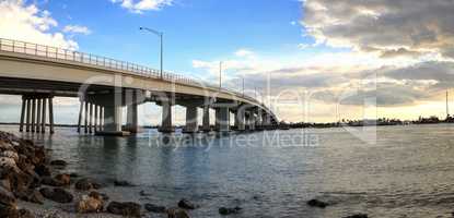 Blue sky over the bridge roadway that journeys onto Marco Island