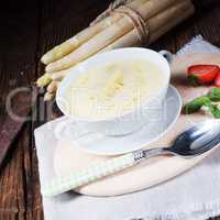 rustic white asparagus cream soup with butter