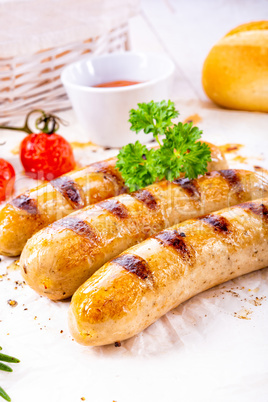 delicious bratwurst with ketchup and fresh rolls